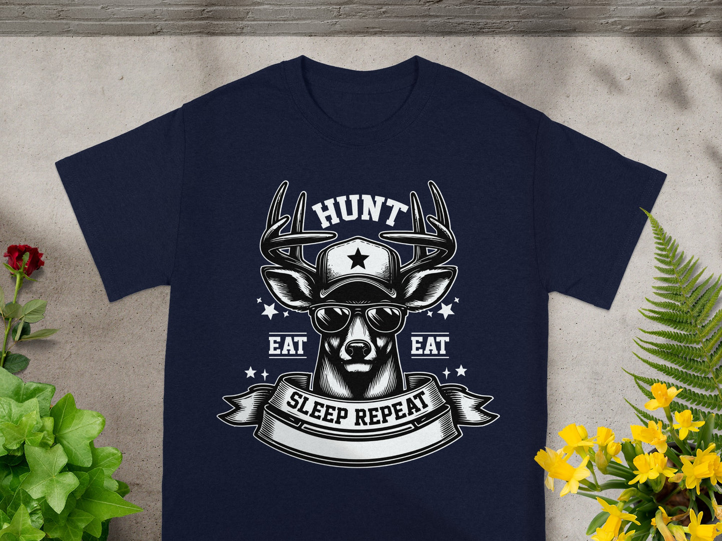 Navy t-shirt with deer graphic, sunglasses, baseball cap, and text: HUNT, EAT, SLEEP REPEAT.
