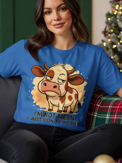 Blue t-shirt with a grumpy cartoon cow saying "I'M NOT MEAN, I JUST DON'T LIKE YOU."