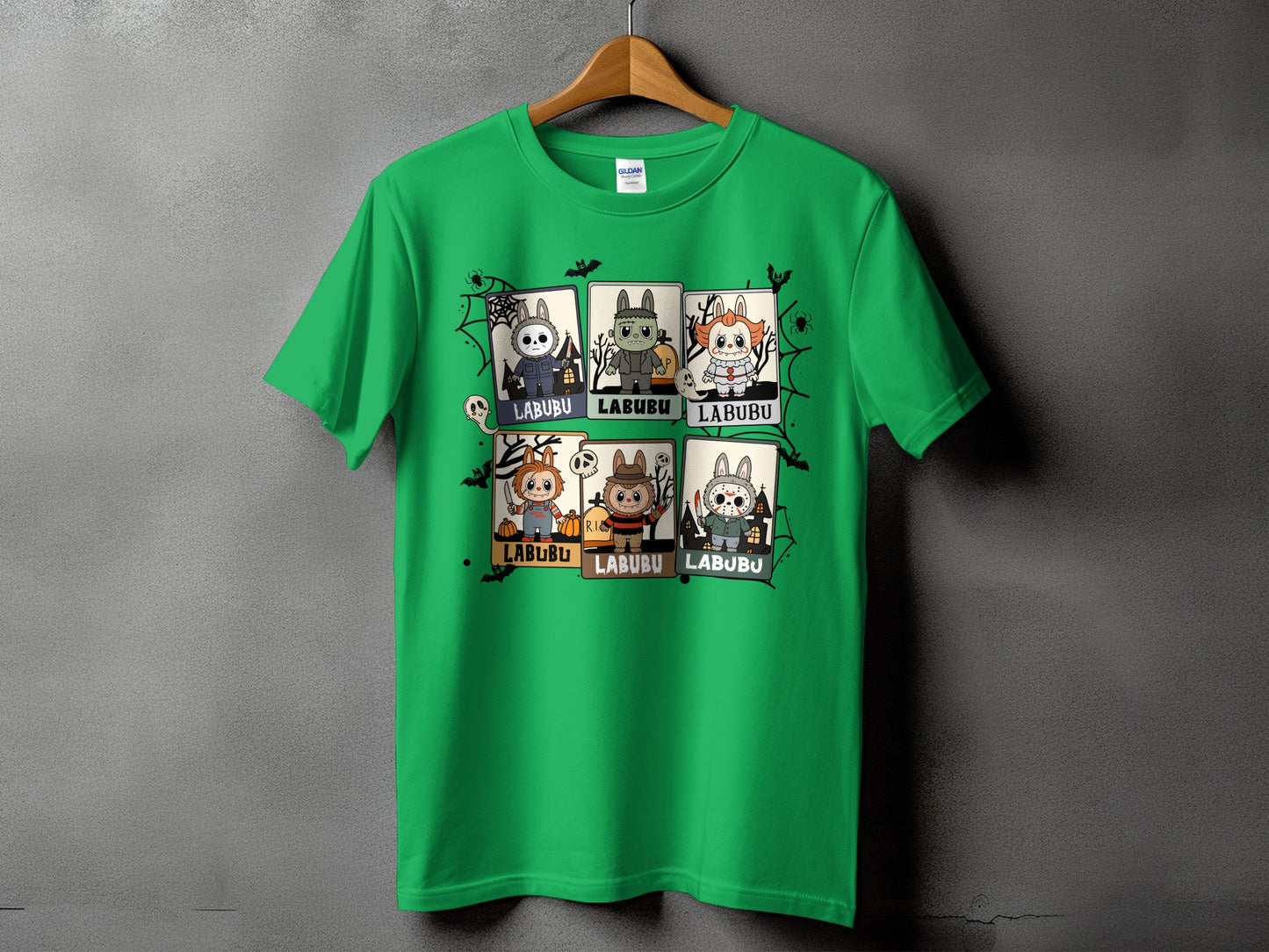 Green t-shirt with Halloween-themed characters and "LABUBU" text on a grey background.