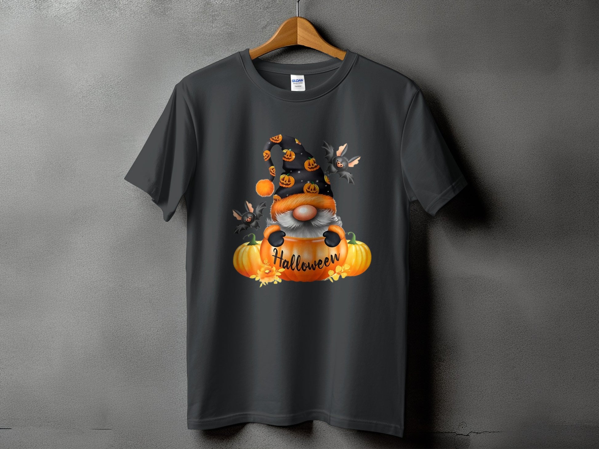 Gnome with bats and pumpkins on a dark grey t-shirt, reads "Halloween."