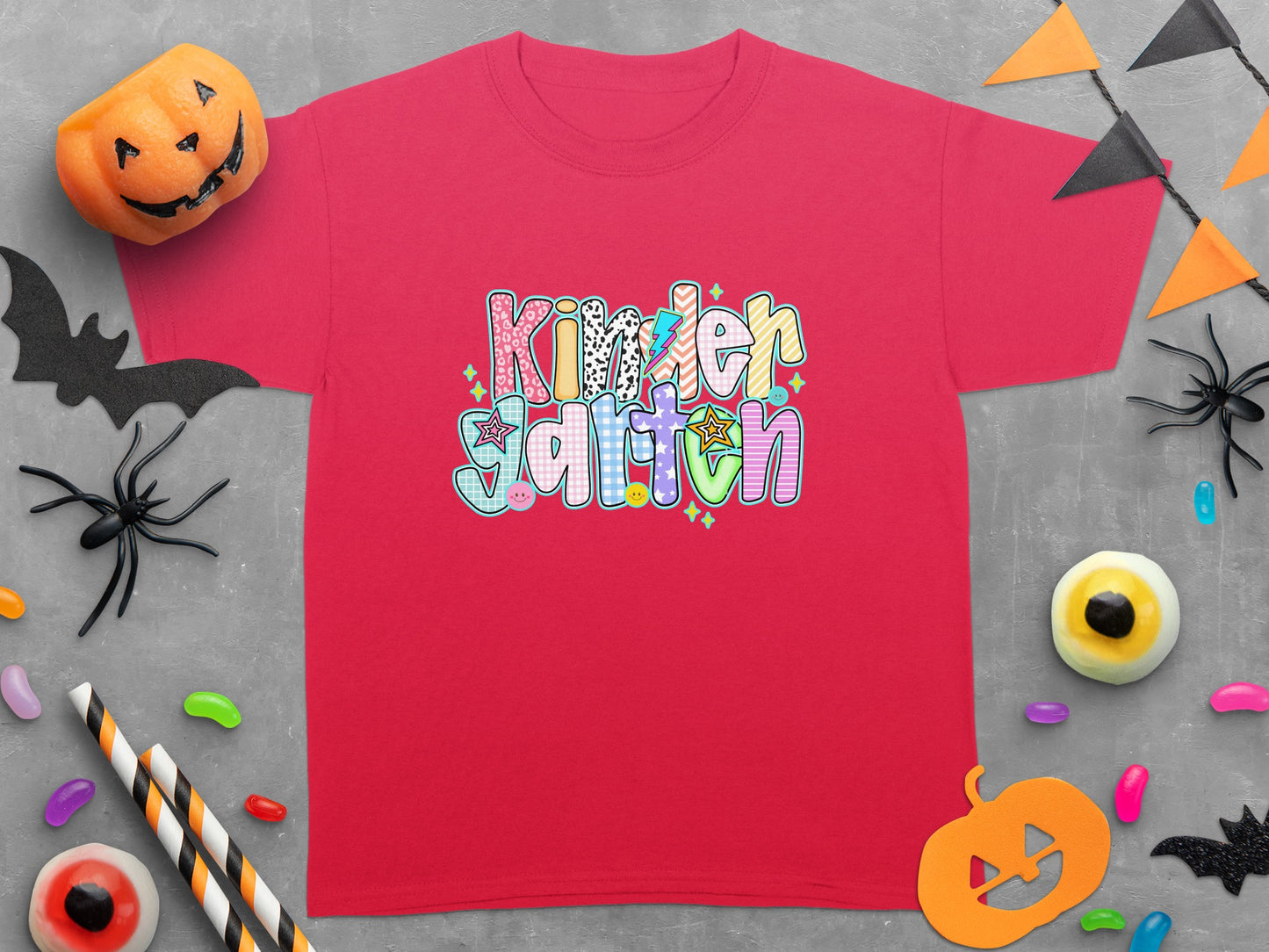 Red t-shirt with "Kindergarten" text in colorful, patterned letters.