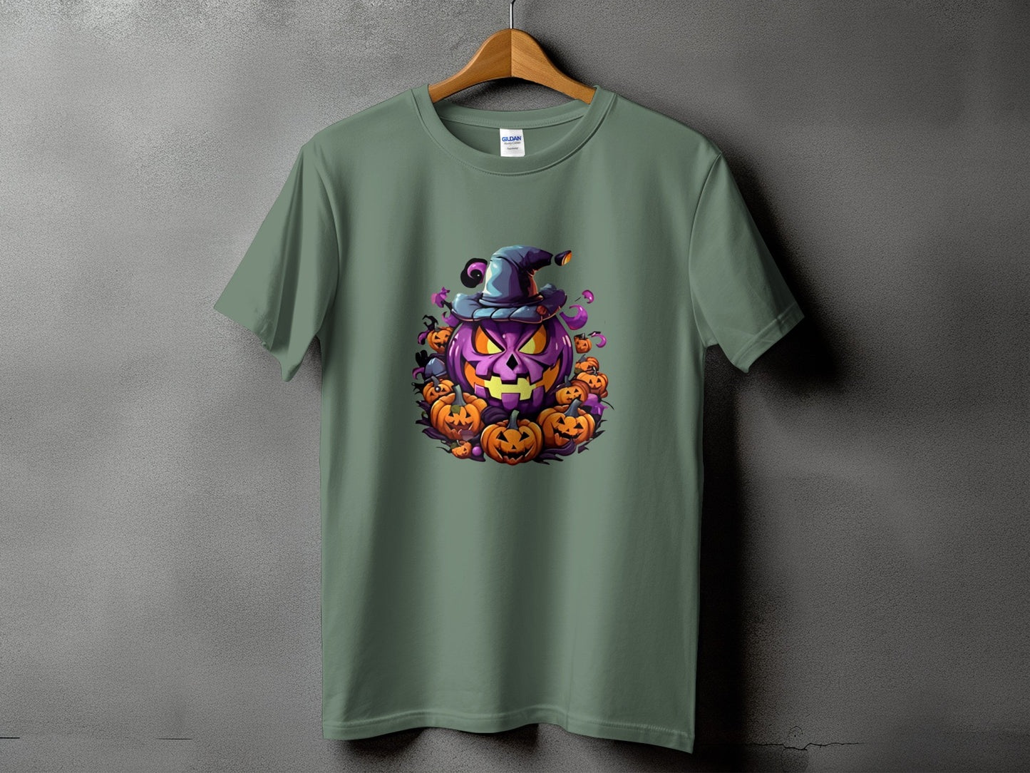 Green t-shirt with a large purple jack-o'-lantern wearing a witch hat surrounded by smaller pumpkins.