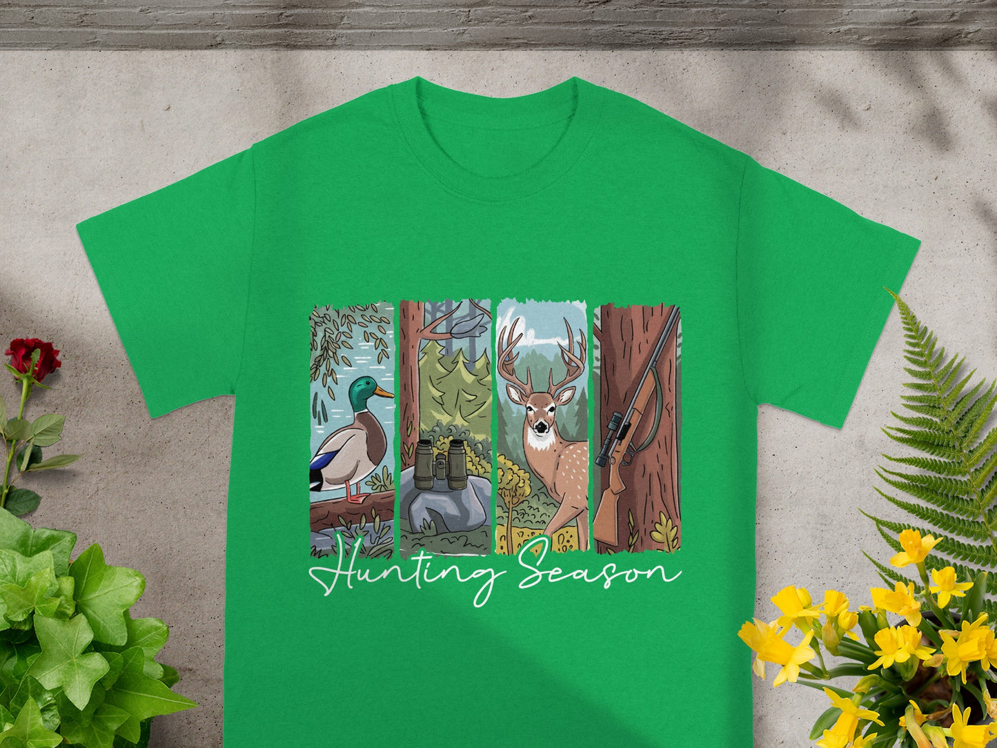 Green t-shirt with a hunting season graphic featuring a duck, binoculars, deer, and rifle.