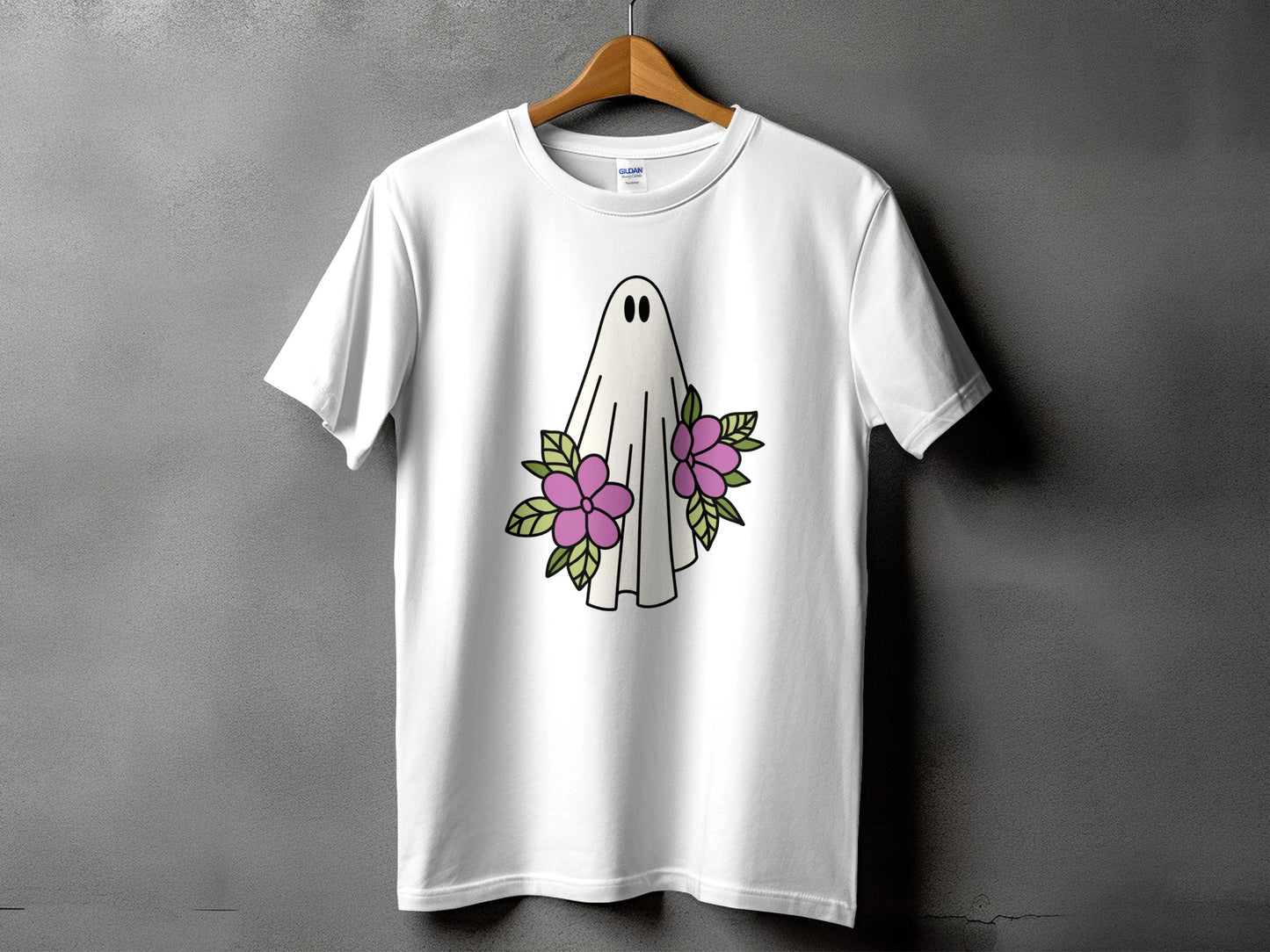 White t-shirt with a cartoon ghost and purple flowers graphic.