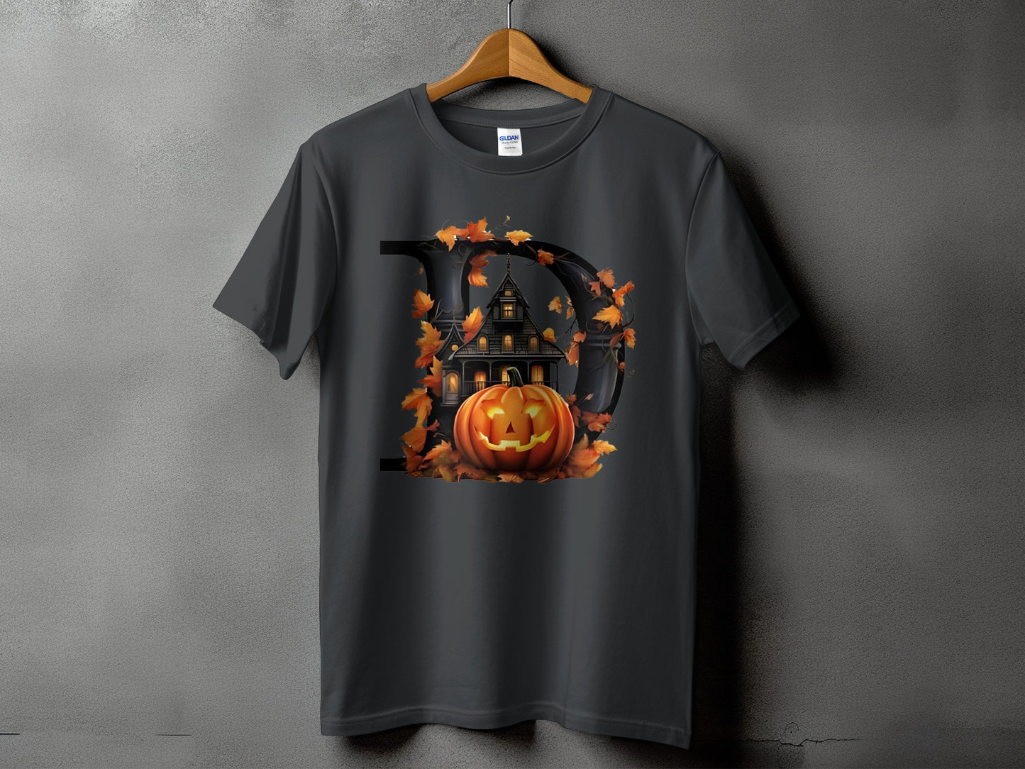 Dark gray t-shirt with a Halloween graphic featuring a large letter D, haunted house, and pumpkin.