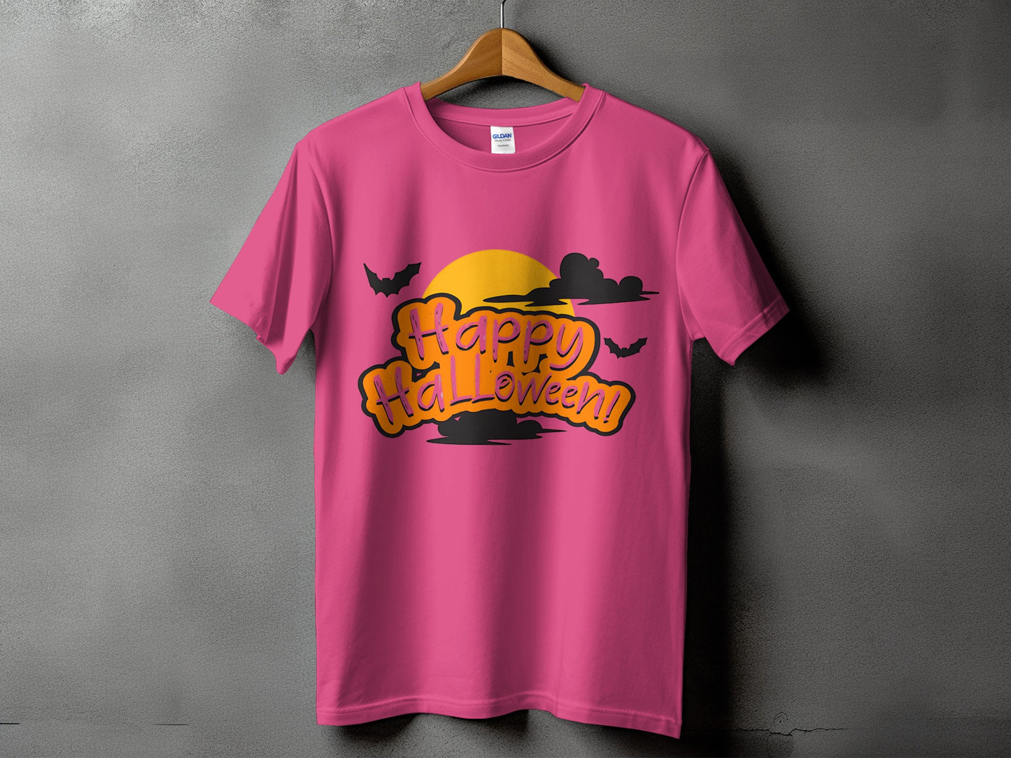 Pink t-shirt with "Happy Halloween!" text, moon, bats, and clouds graphic.