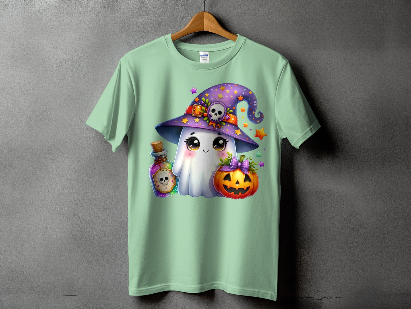 Ghost with witch hat, pumpkin, and potion bottle graphic on mint t-shirt.