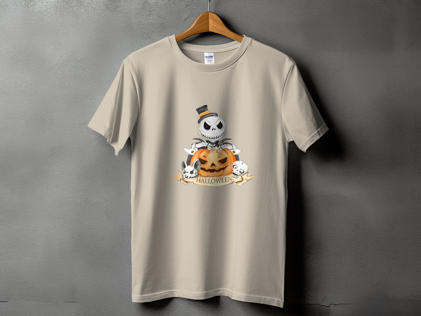Light tan t-shirt with a Halloween graphic featuring Jack Skellington, a pumpkin, and skulls.