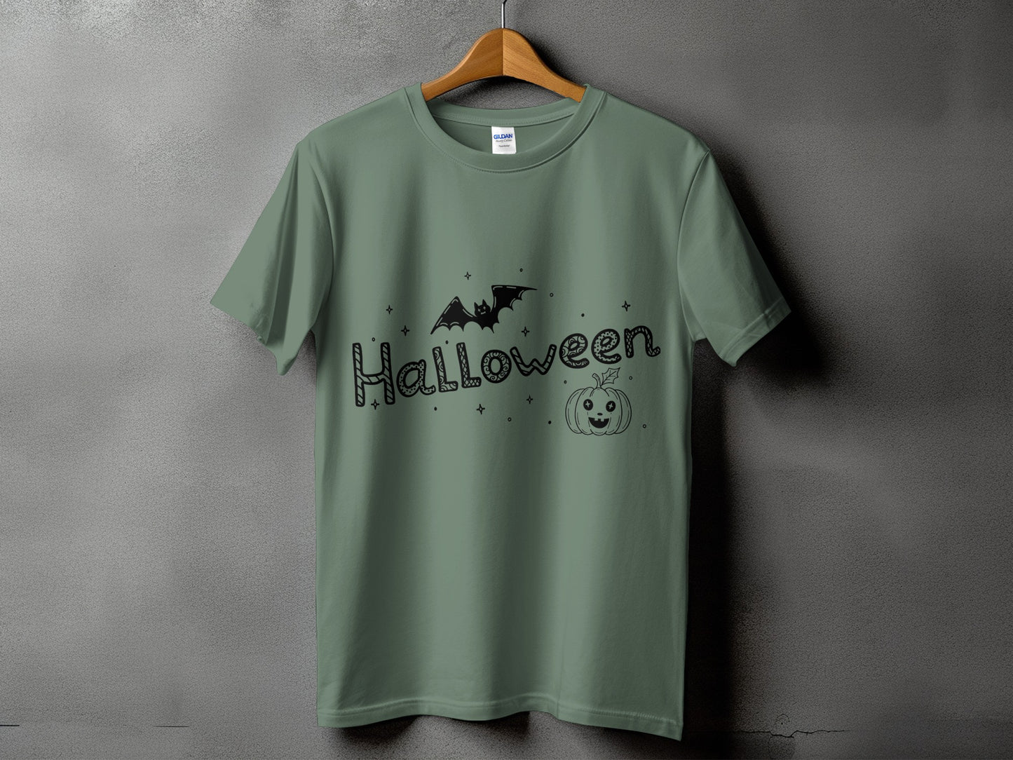 Green t-shirt with black Halloween graphic including bat and pumpkin.
