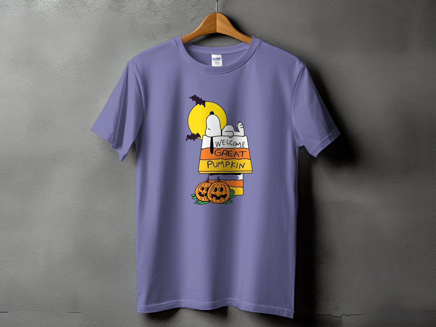 Snoopy on candy corn welcomes the Great Pumpkin with two jack-o'-lanterns and bats.