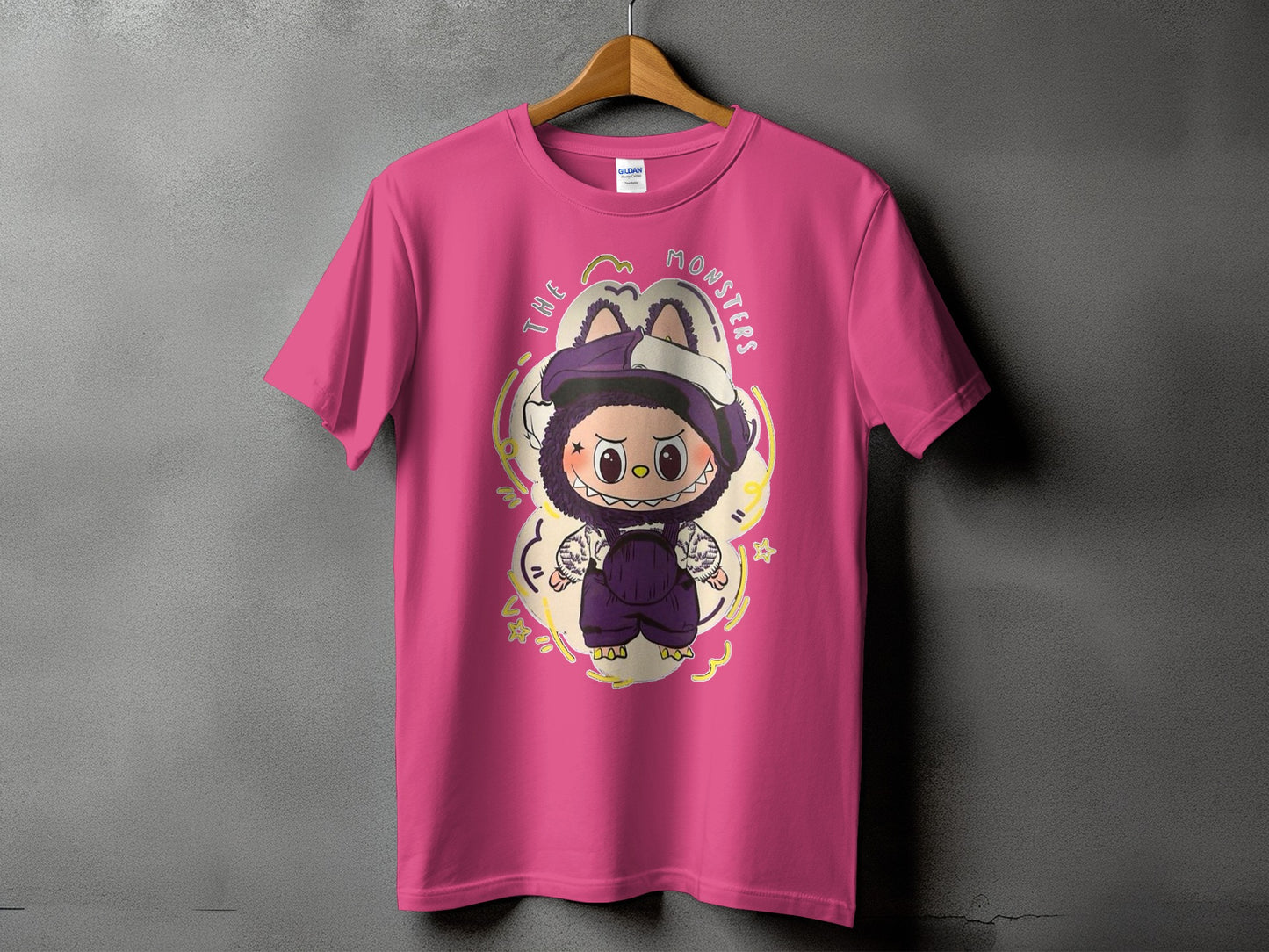 Pink t-shirt with "The Monsters" text and a cartoon monster illustration.