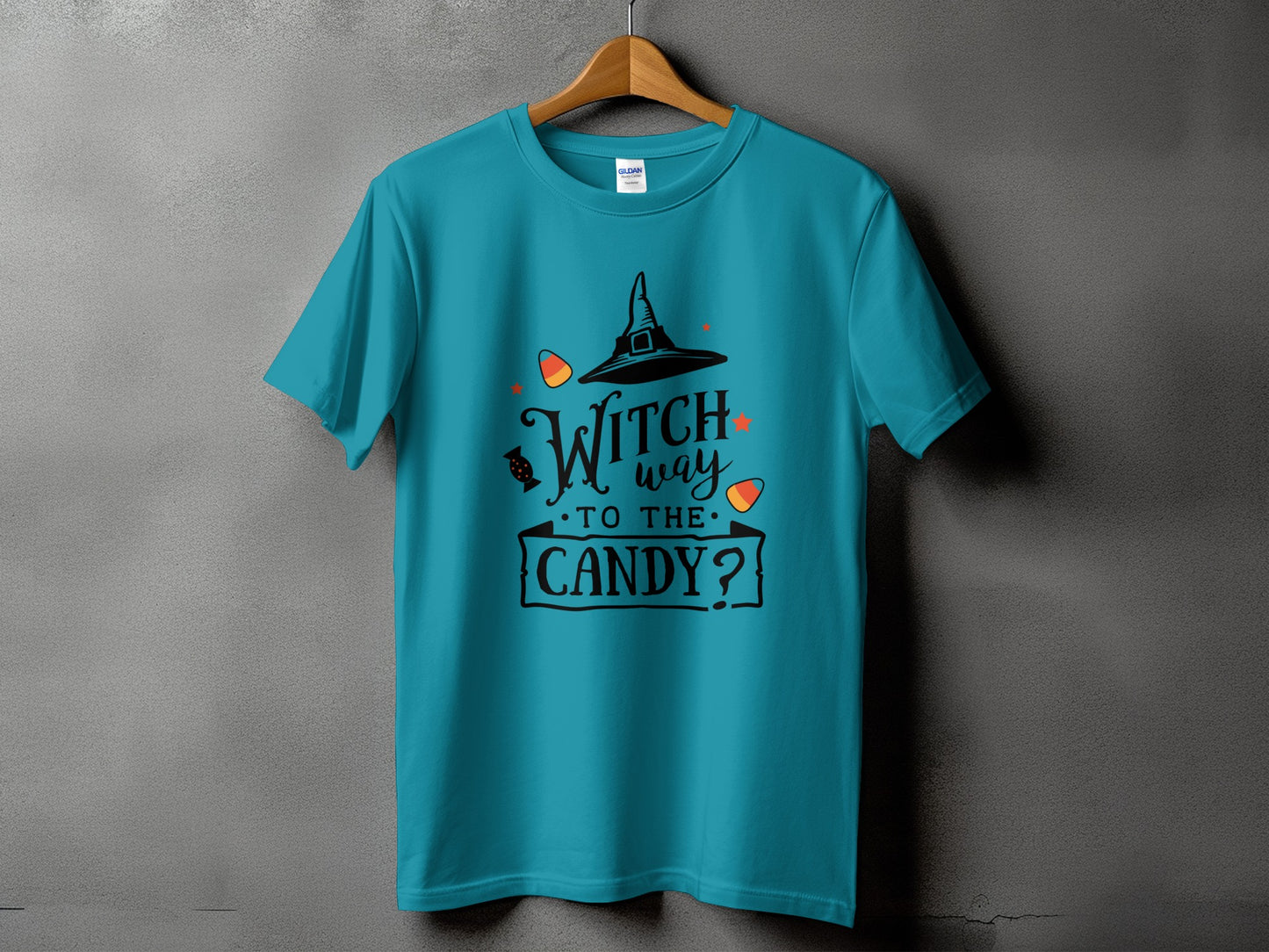 Teal t-shirt with "Witch way to the candy?" Halloween graphic.