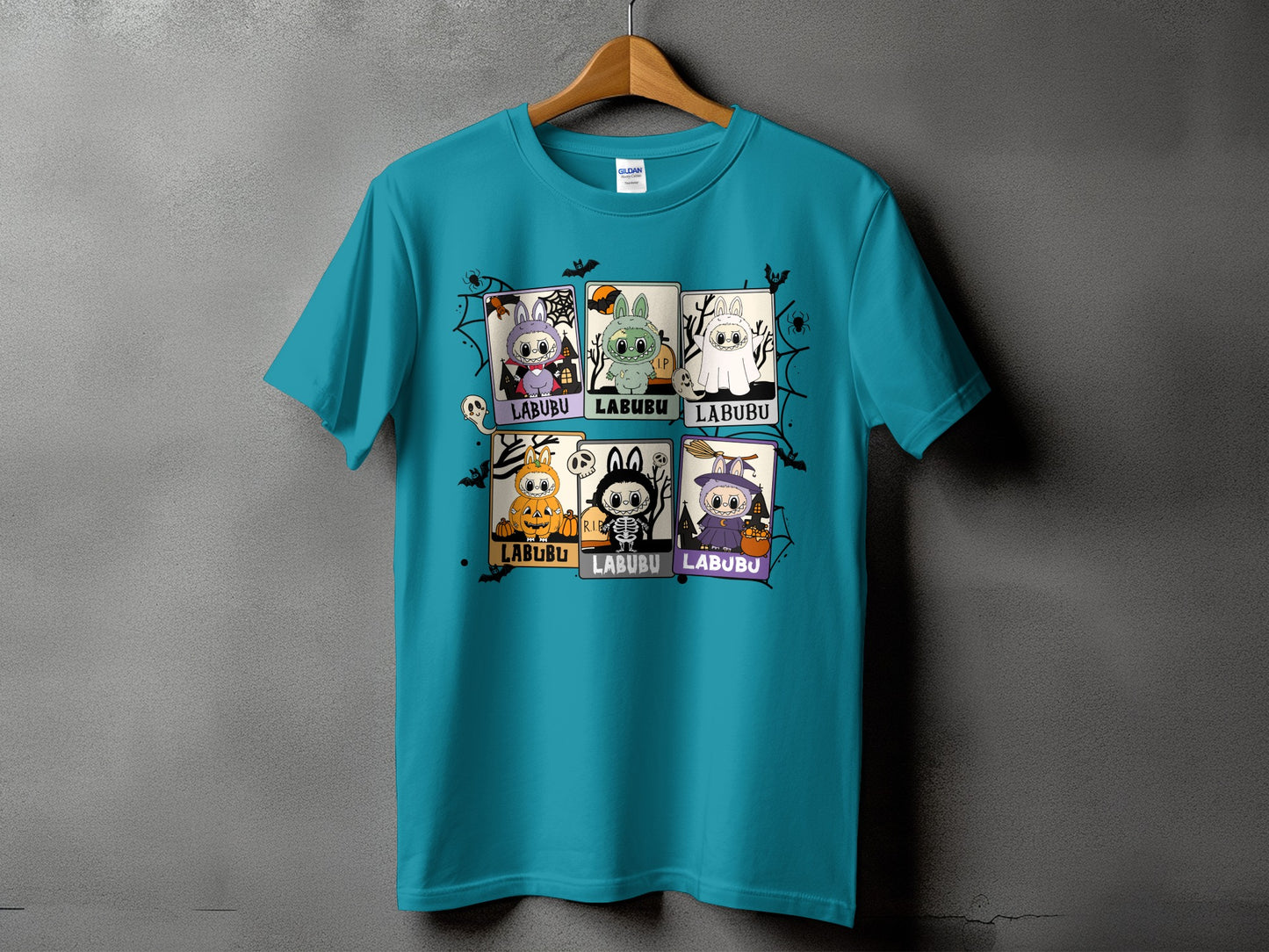 Teal t-shirt with six Halloween-themed "LABUBU" character panels.