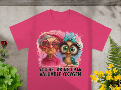 Pink t-shirt with a grumpy older woman and a cartoon owl wearing a bow tie.