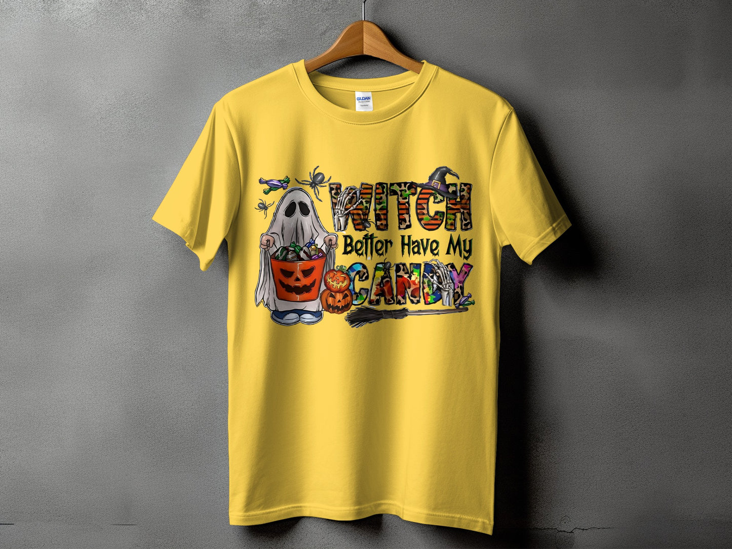 Yellow t-shirt with a ghost, candy bucket, and "Witch Better Have My Candy" Halloween graphic.