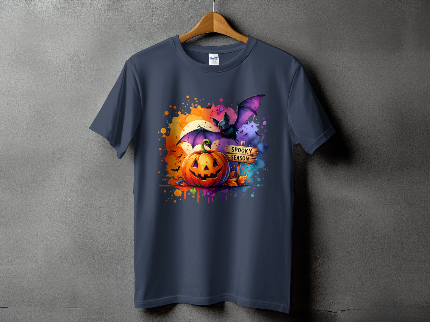 Halloween t-shirt with a jack-o'-lantern, bat, and "Spooky Season" sign.