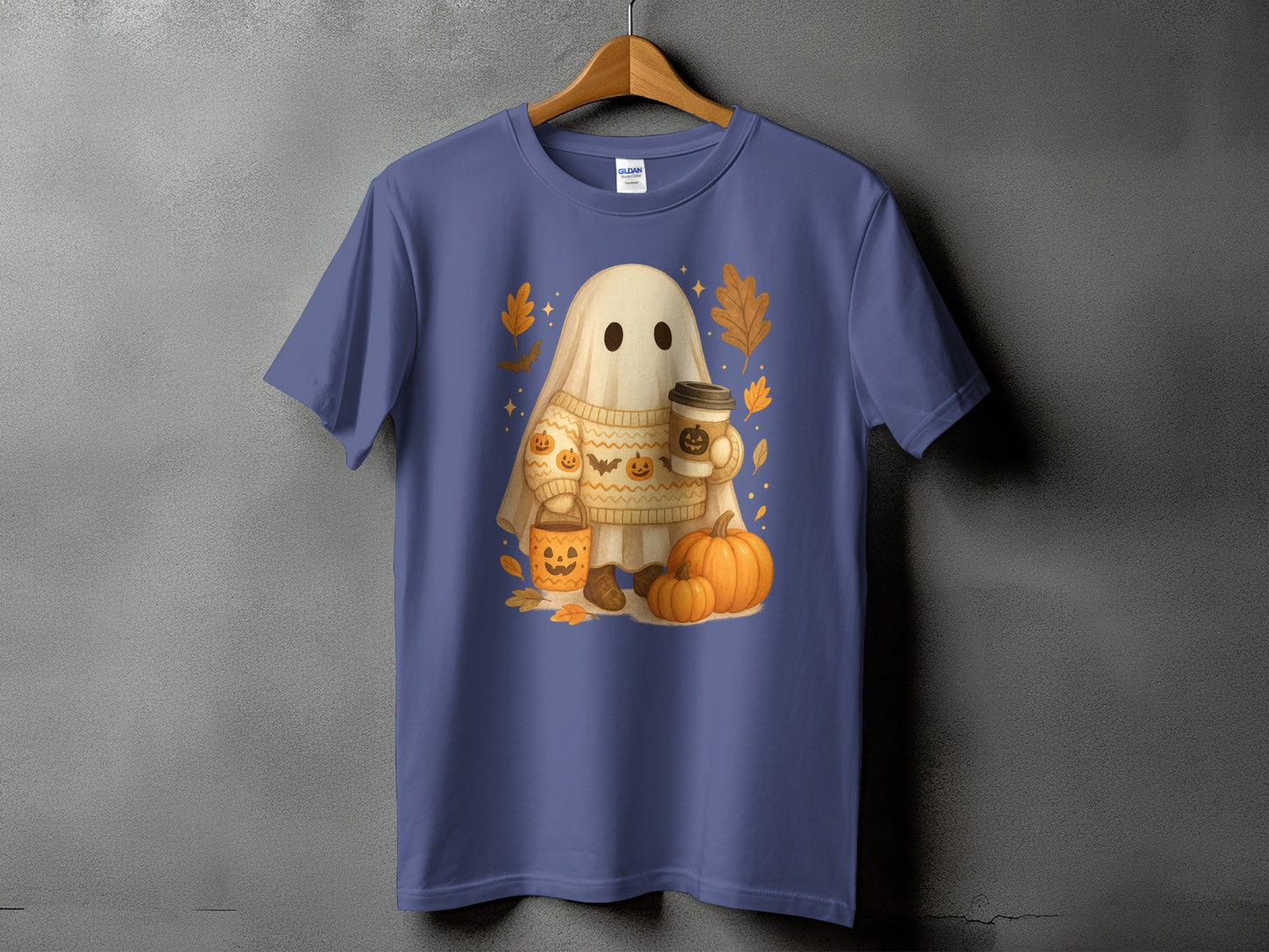 Ghost with pumpkins and coffee on a sweater, surrounded by autumn leaves.
