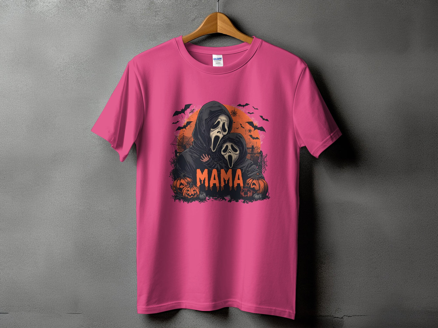 Pink t-shirt with "Mama" and ghost figures on a Halloween theme graphic.