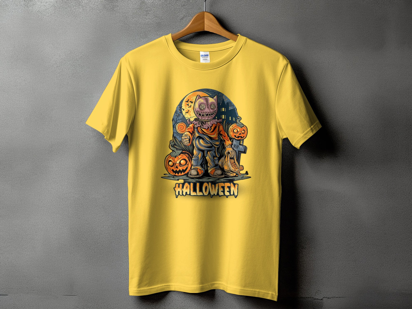 Yellow t-shirt with Halloween graphic featuring a burlap-faced character and pumpkins.
