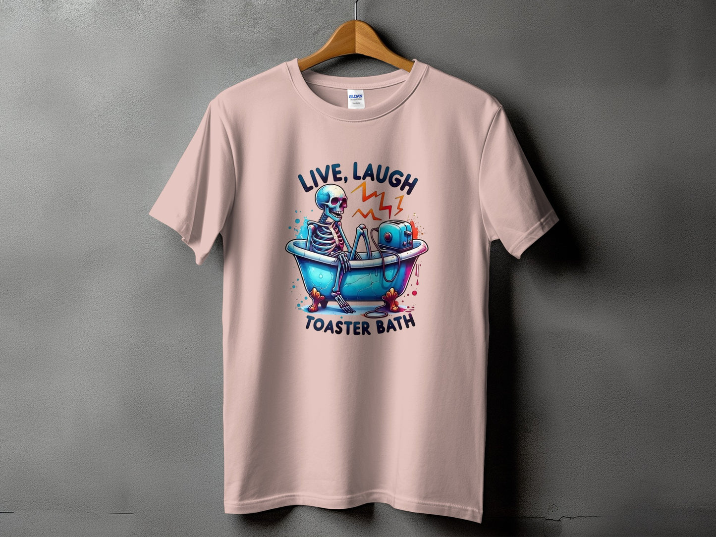 Pink t-shirt with "Live, Laugh, Toaster Bath" text and skeleton graphic.