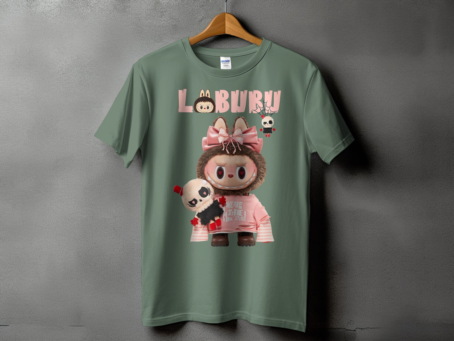 Green t-shirt with "LABURU" text and cute monster characters.