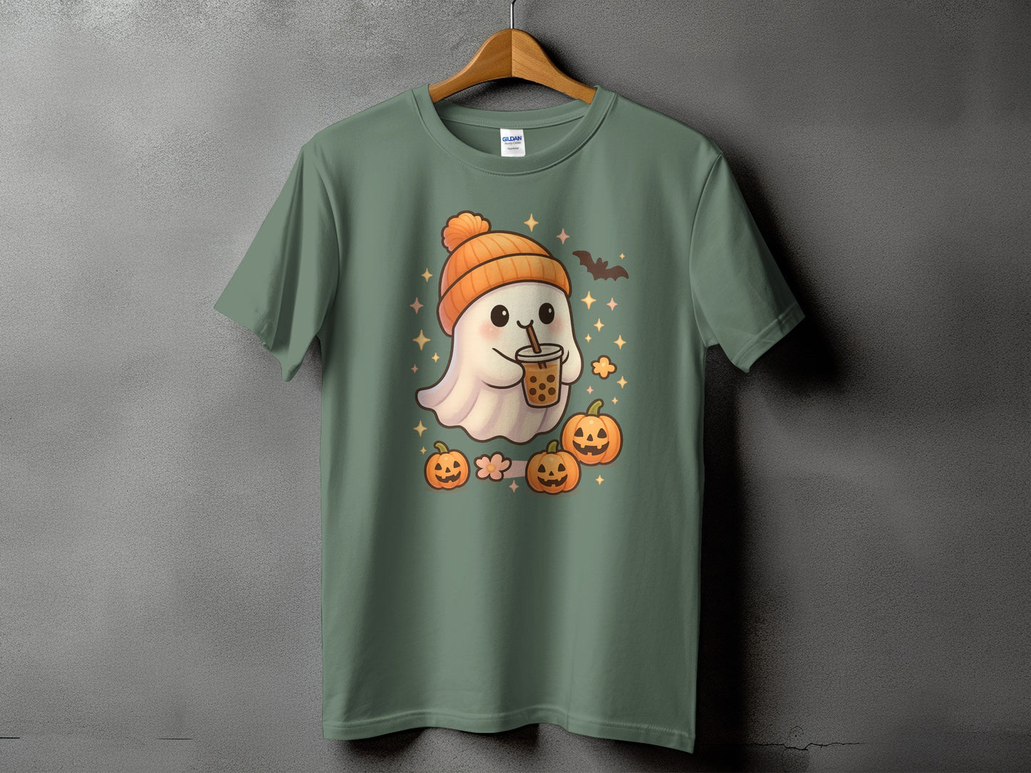 Ghost with boba, pumpkins, bat, and stars on a green t-shirt.