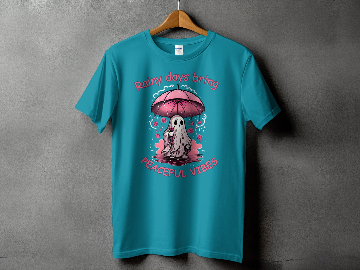 Ghost under umbrella with pink roses, text "Rainy days bring Peaceful Vibes".