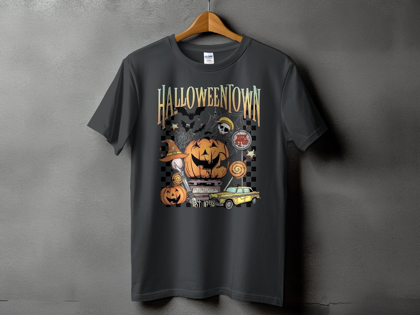 T-shirt with Halloweentown graphic featuring pumpkins, bats, a yellow taxi, and "EST 1998".