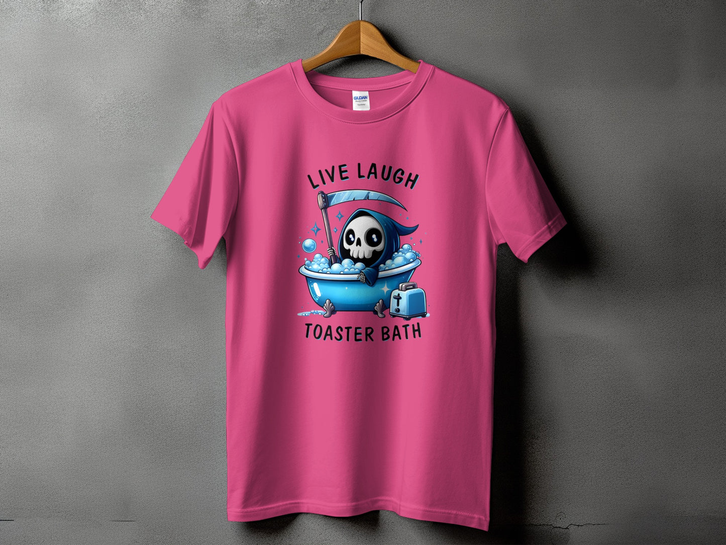 Pink t-shirt with grim reaper in a bathtub graphic and text "Live Laugh Toaster Bath".