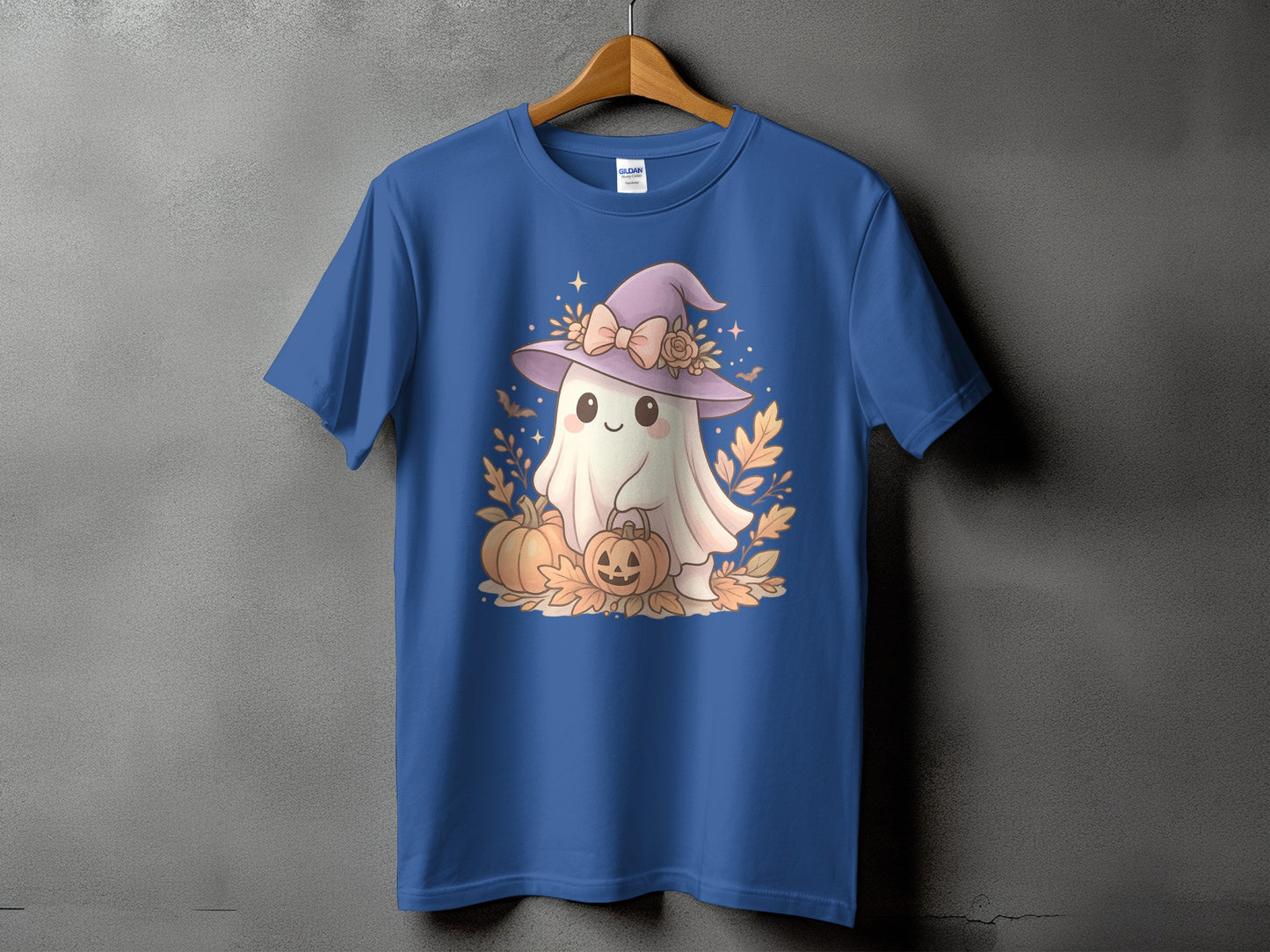 Blue t-shirt with a kawaii ghost wearing a witch hat holding a pumpkin.