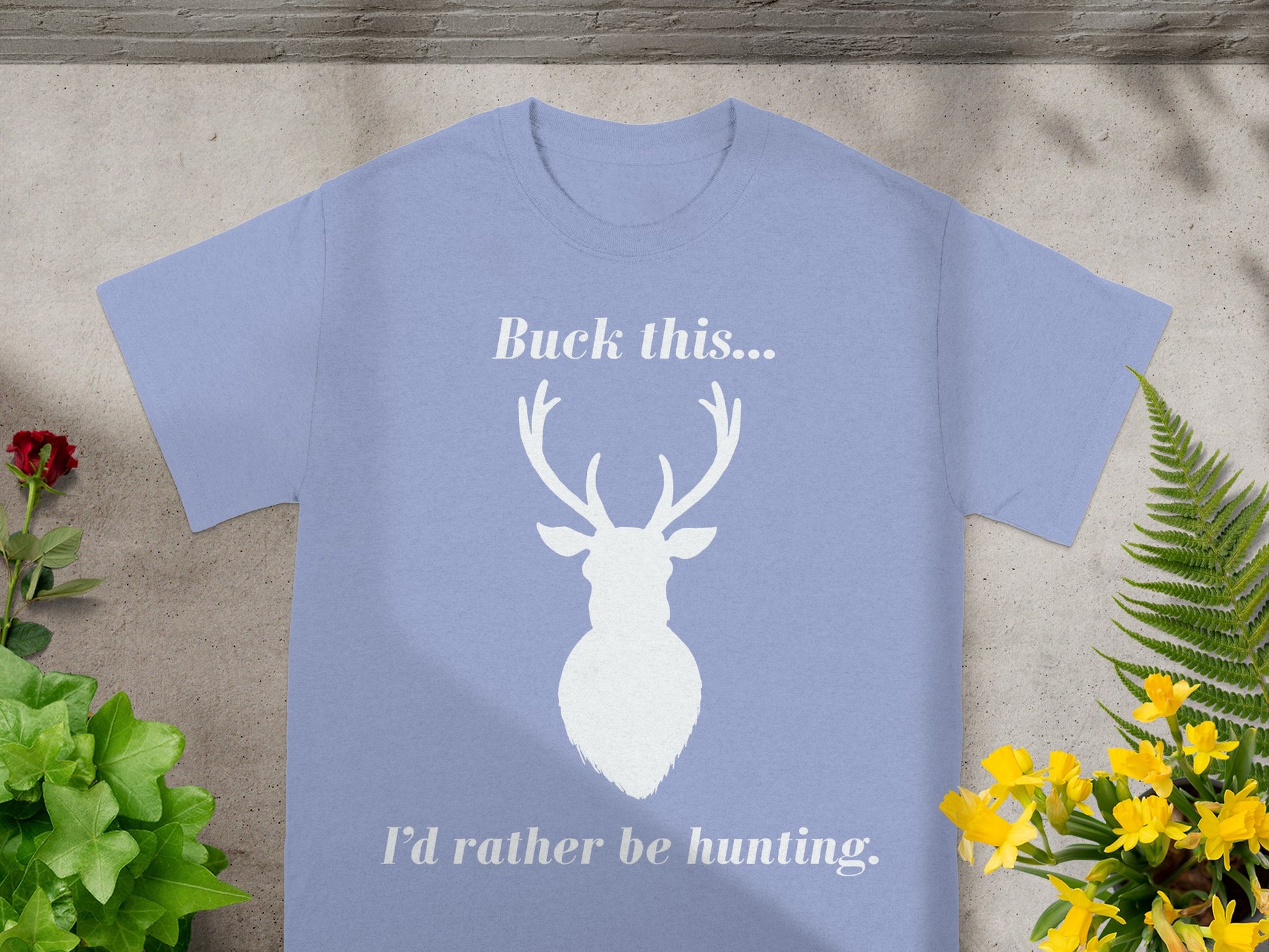 Periwinkle t-shirt with white deer silhouette and text "Buck this... I'd rather be hunting."