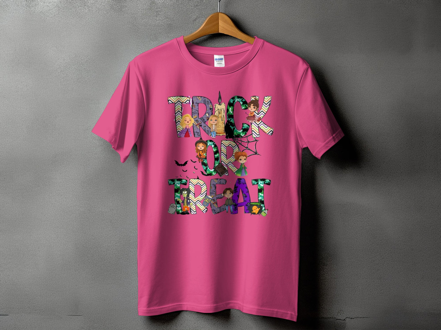 Pink t-shirt with "Trick or Treat" Halloween graphic featuring cartoon characters.