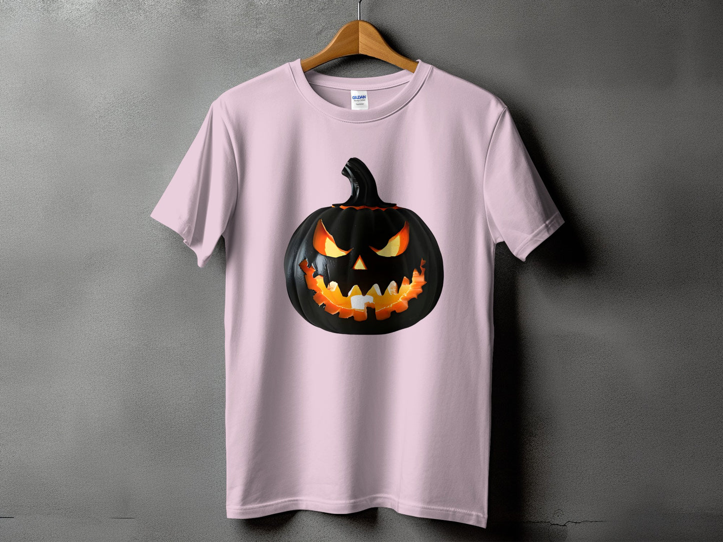 Light pink t-shirt with a black jack-o'-lantern graphic.