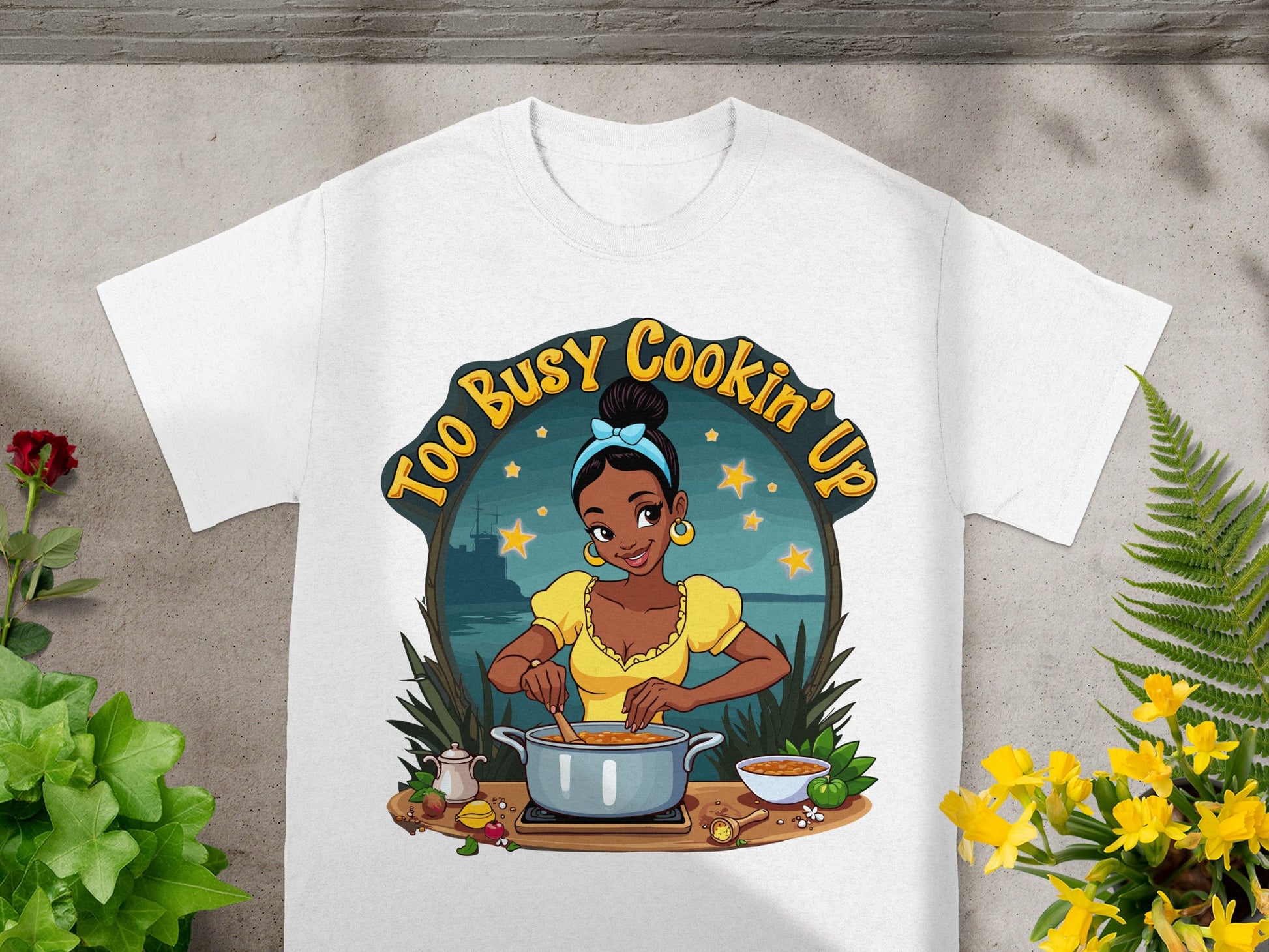 Tiana cooking in a pot with "Too Busy Cookin' Up" text.