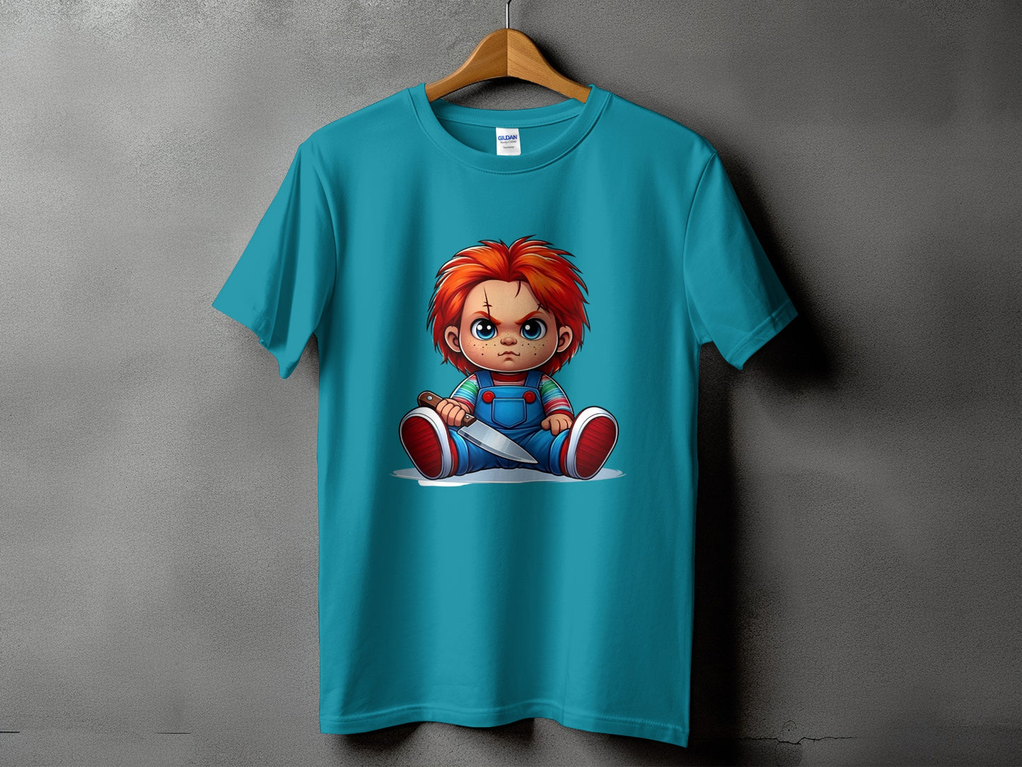 Teal t-shirt featuring a cartoon image of Chucky holding a knife.