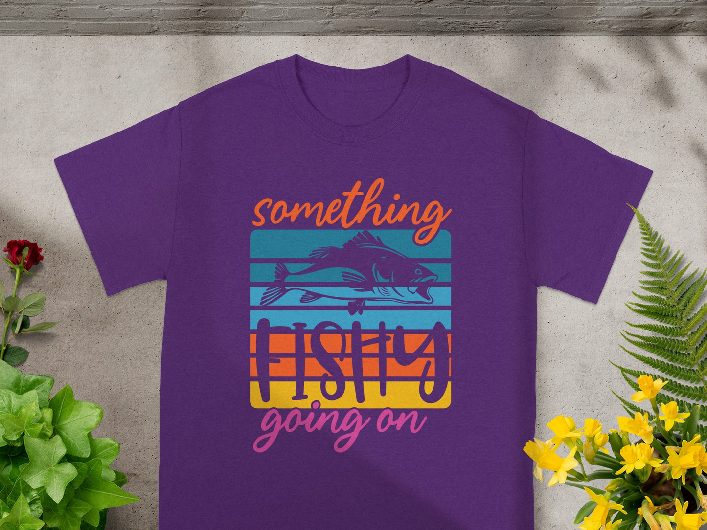 Purple t-shirt with "Something Fishy Going On" graphic and fish silhouette.