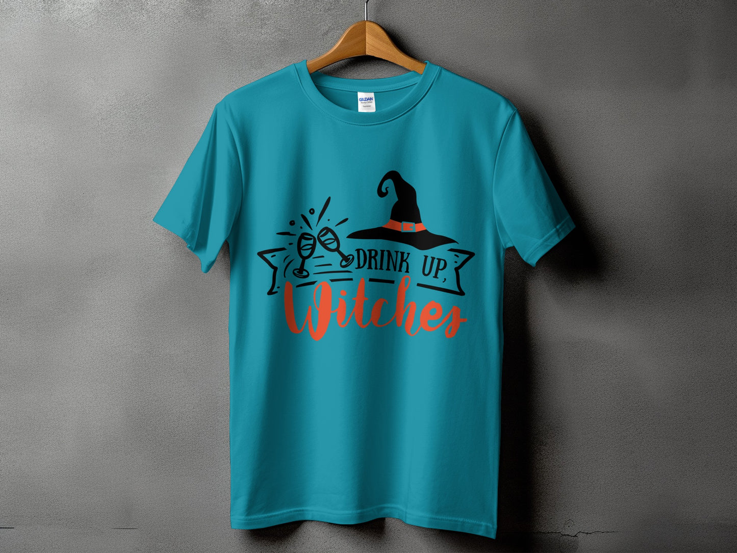 Teal t-shirt with Halloween graphic and text "DRINK UP, Witches".