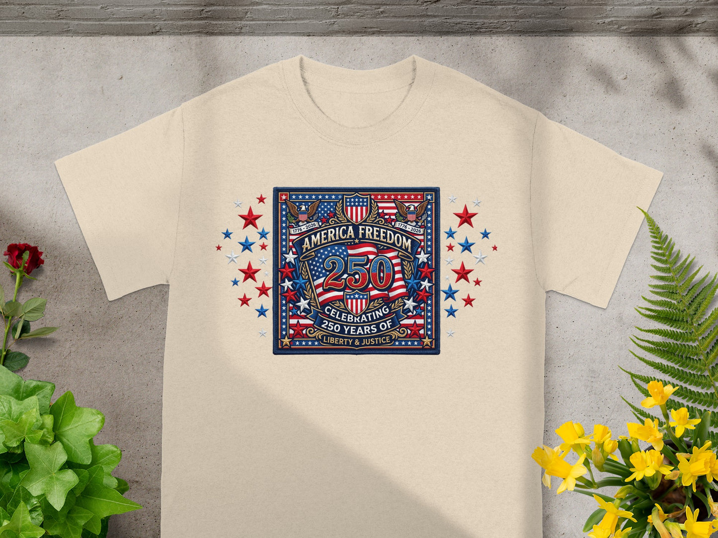 Cream t-shirt with "America Freedom 250" graphic celebrating 250 years of liberty and justice.