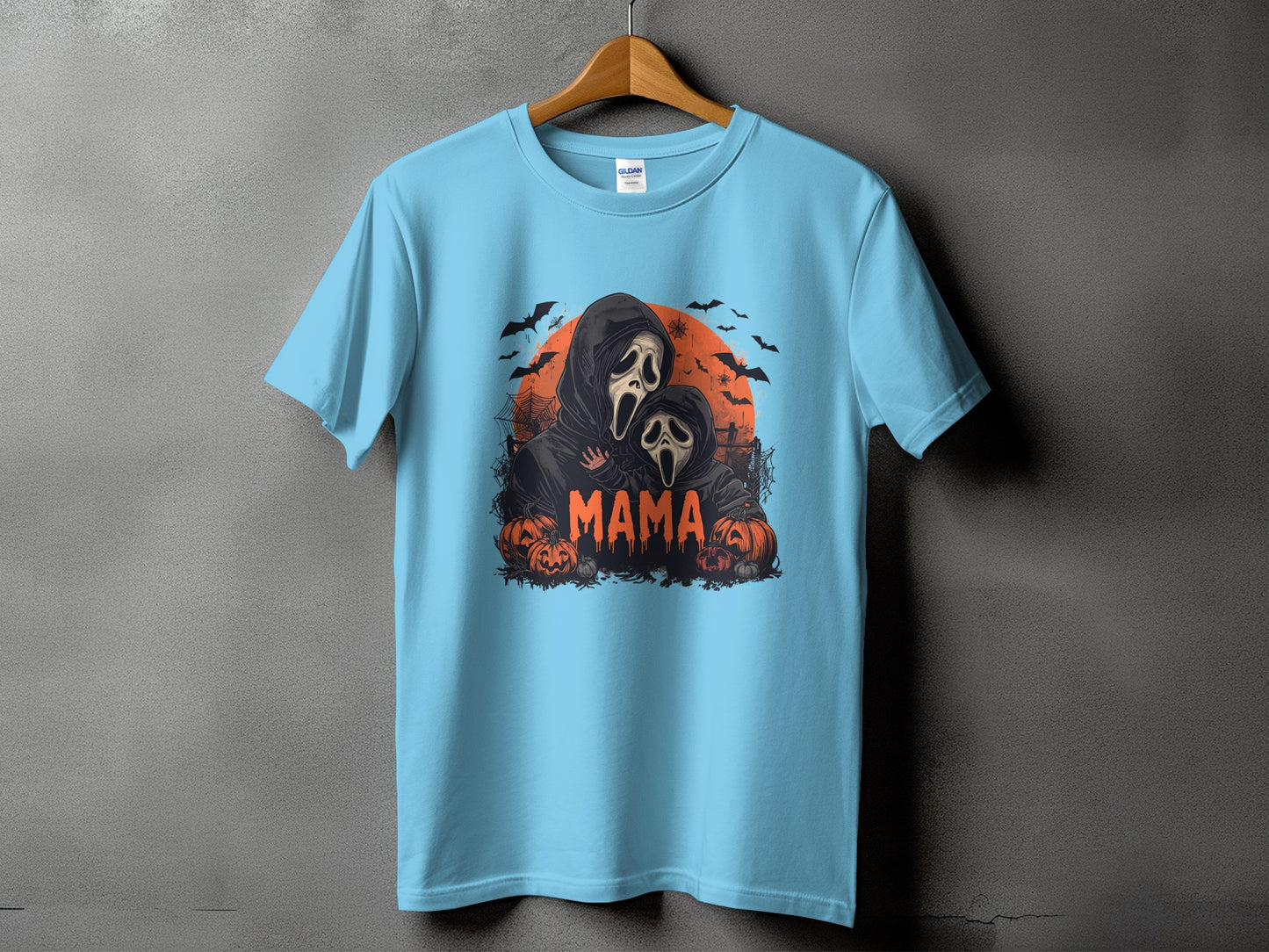 Light blue t-shirt with ghost figures and "Mama" text, Halloween theme.
