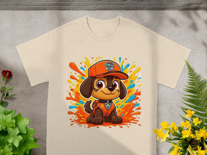 Chase from Paw Patrol on a cream t-shirt with colorful splatters.