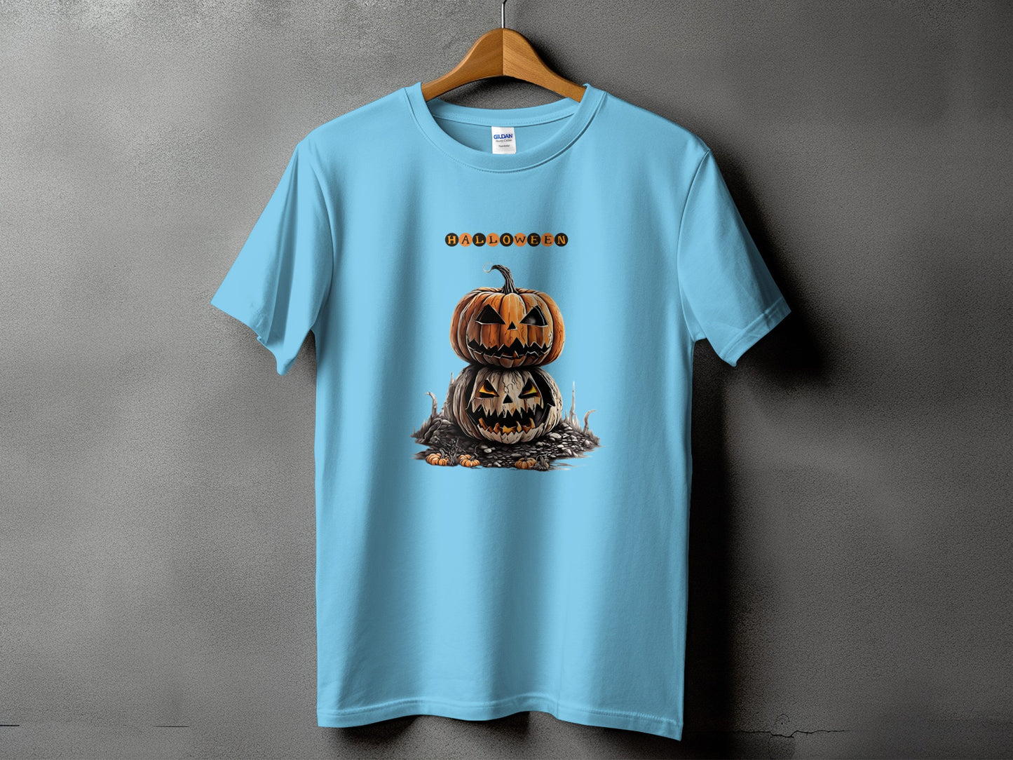 Light blue t-shirt with stacked Halloween pumpkins and text.