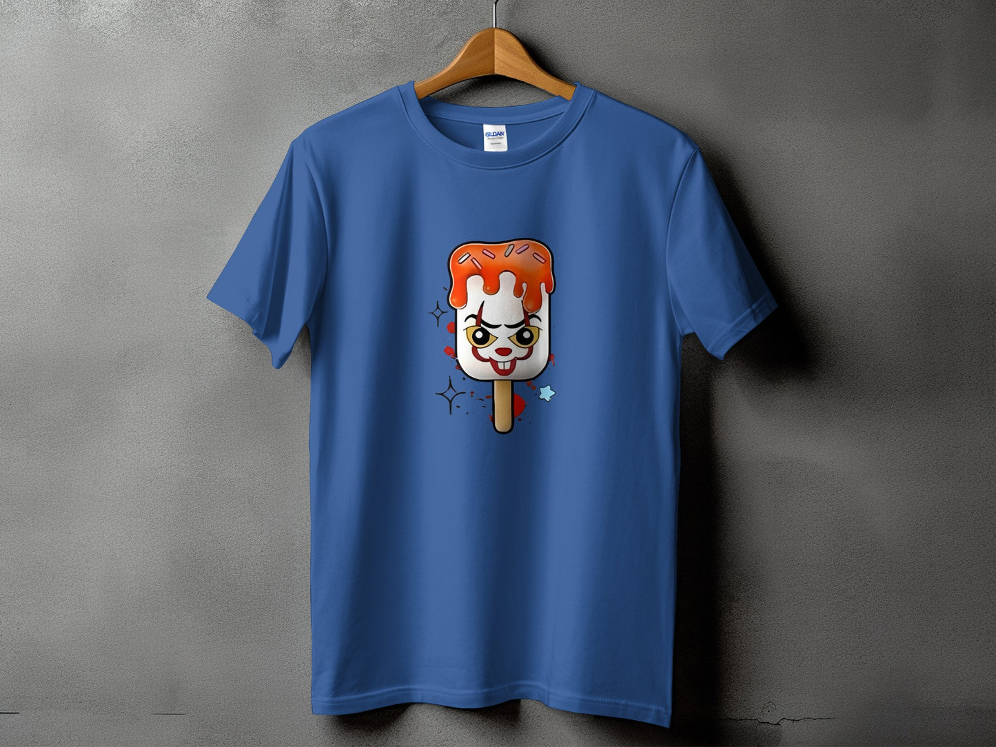 Blue t-shirt with a creepy clown popsicle graphic.