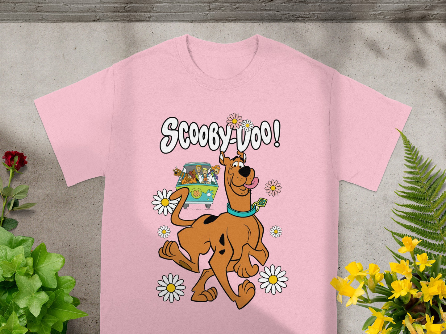 Scooby-Doo text with Scooby-Doo running with Mystery Machine and friends behind him.