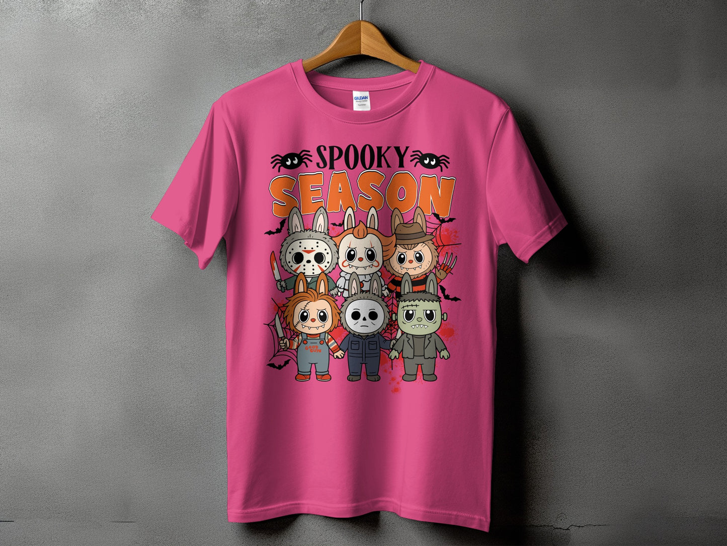 Pink t-shirt with "Spooky Season" and cartoon horror characters.