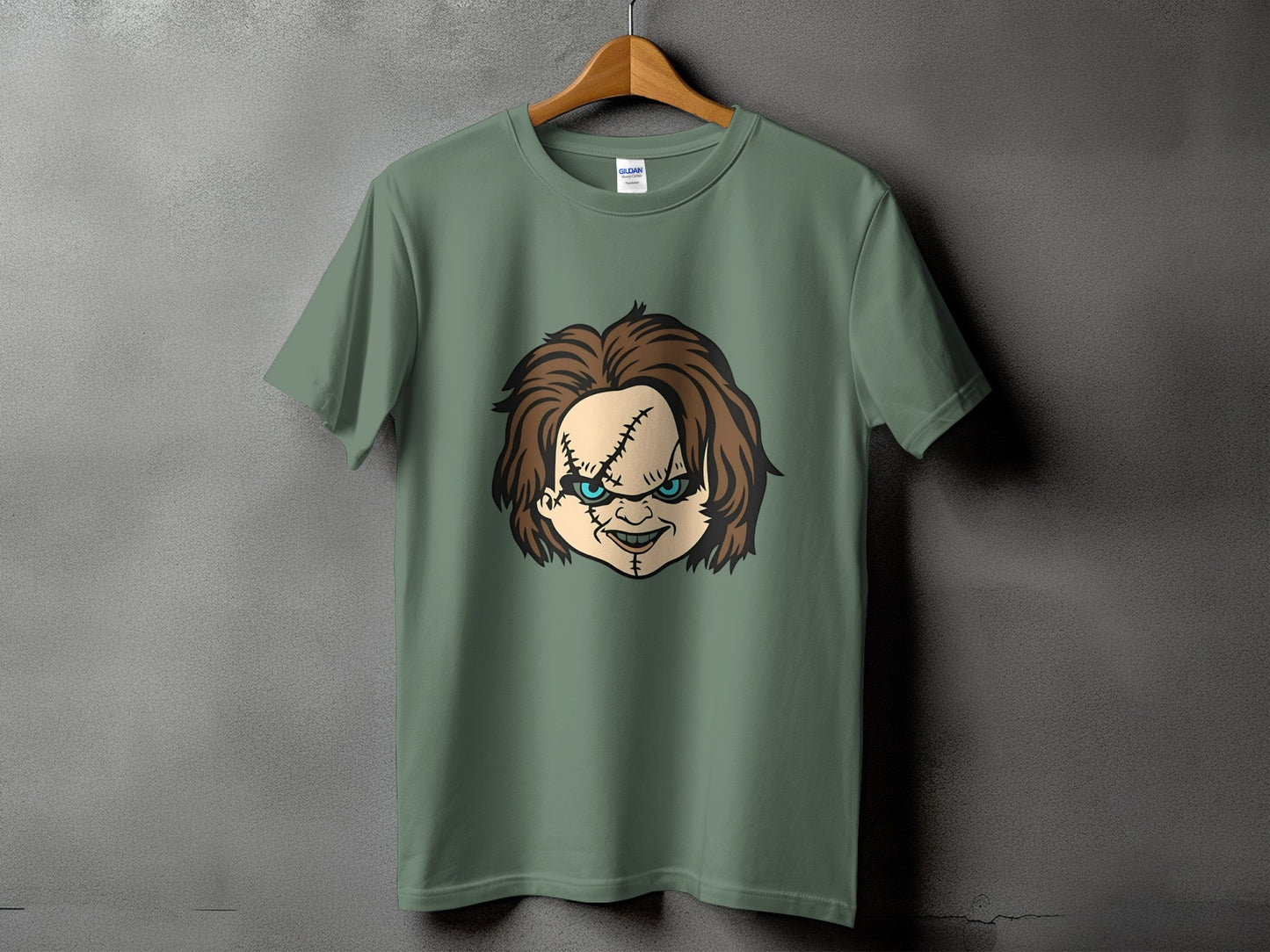 Green t-shirt with Chucky doll face graphic on the front.