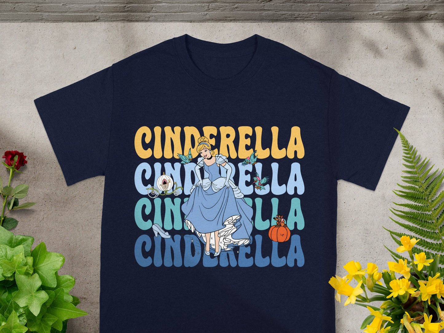 Navy t-shirt with Cinderella graphic and text.