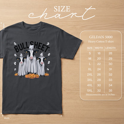 Dark grey t-shirt with cows in ghost costumes and pumpkins, featuring "BULLSHEET" text and size chart.