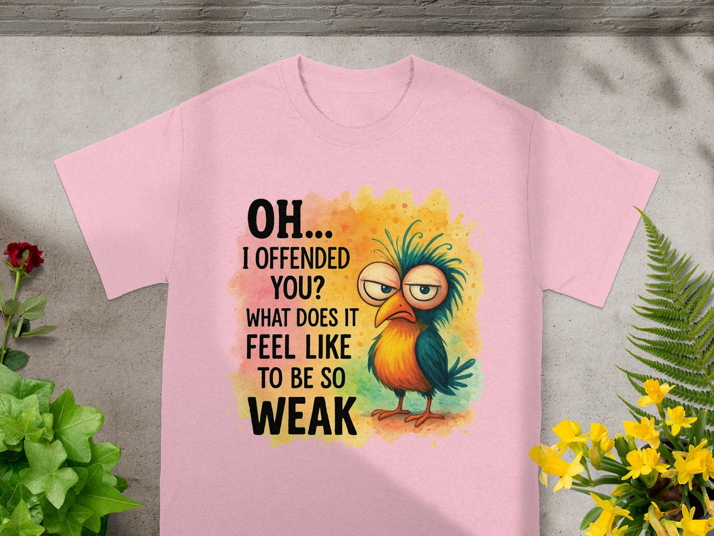 Pink t-shirt with cartoon bird and text "OH... I OFFENDED YOU? WHAT DOES IT FEEL LIKE TO BE SO WEAK".