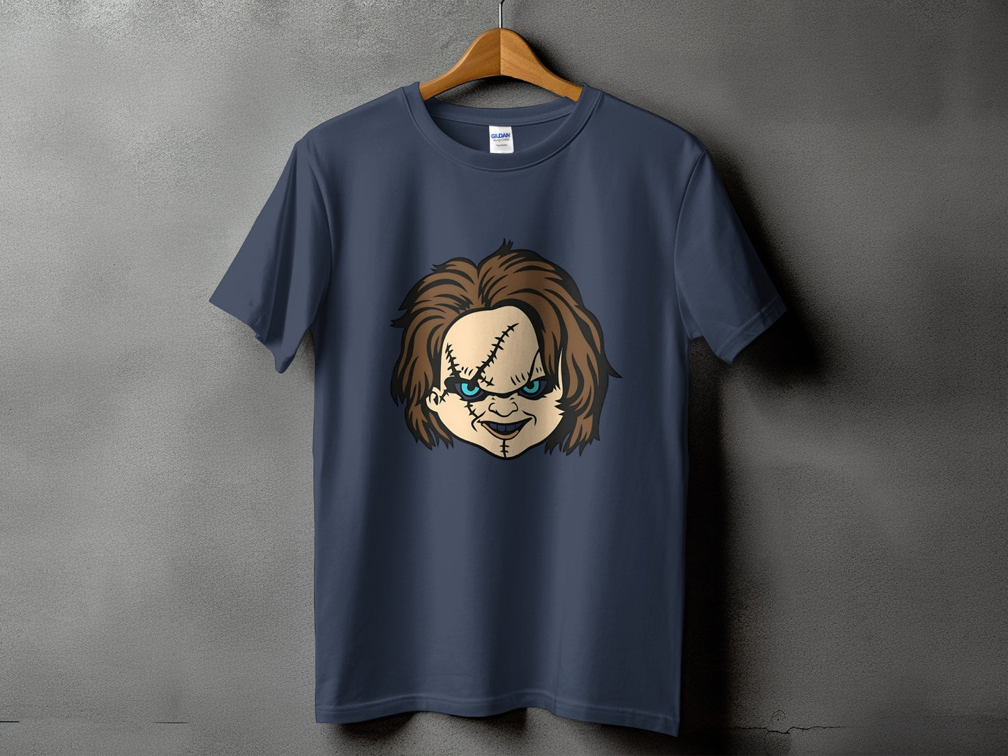 Dark navy t-shirt featuring a graphic of Chucky's stitched face with blue eyes.