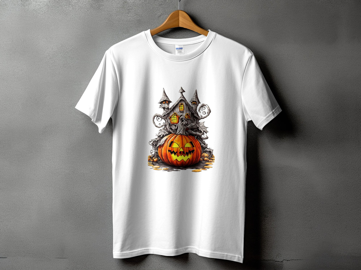 White t-shirt with a Halloween graphic of a haunted house and jack-o'-lantern.